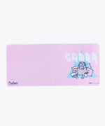 Close up of the Pusheen the Cat Logo on the lower left side of the Gaming Desk Mat. The edges of the mat are sewn, and the rubber base is partially visible.