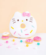 Full front view of Hello Kitty side of reversible Donut Plush. Donut plush lays on light white carpet surface.  