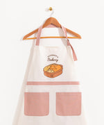 Front view of a white apron and dusty pink straps and pocket details. Both the neck ties and back straps are adjustable. 