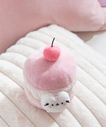 Plush Macaron of Pusheen the Cat with a 3D medium pink cherry with a brown stem. 
