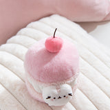 Plush Macaron of Pusheen the Cat with a 3D medium pink cherry with a brown stem. 