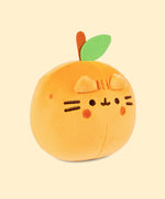 Back view of the Pusheen Fruits Orange Squisheen Plush. The back of the orange squisheen has Pusheen’s signature back stripes duo embroidered in dark orange. Under the stripes is Pusheen’s striped tail in alternating orange colors. Coming off the top of the plush is a brown felt stem and green felt leaf. 