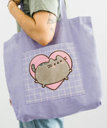 Back view of Pusheen Heart Deluxe Tote Bag. The purple tote bag has purple handles that are attached to the opening of the bag.