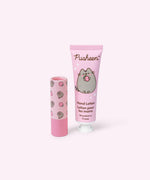 Pusheen strawberry hand lotion and unscented lip balm set has pink packaging with strawberry graphics. 