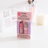 Front and side view of the Pusheen lip balm and hand lotion set. The packaging is pink and light purple and includes product details such as the size of the included lip balm and lotion. 