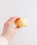 Side and back view of the Pusheen Surprise Squishy Toy Assormtnet. Pusheen's striped tail is engraved at the back of the toy.