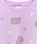 Pusheen Twilight Pajama bottoms lie on a flat surface. The jumping cat is printed all over the lounge bottoms.