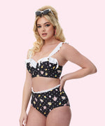 Model lies on sun lounger while wearing the Pusheen Tropical Fruit Bikini Set and hair scarf.